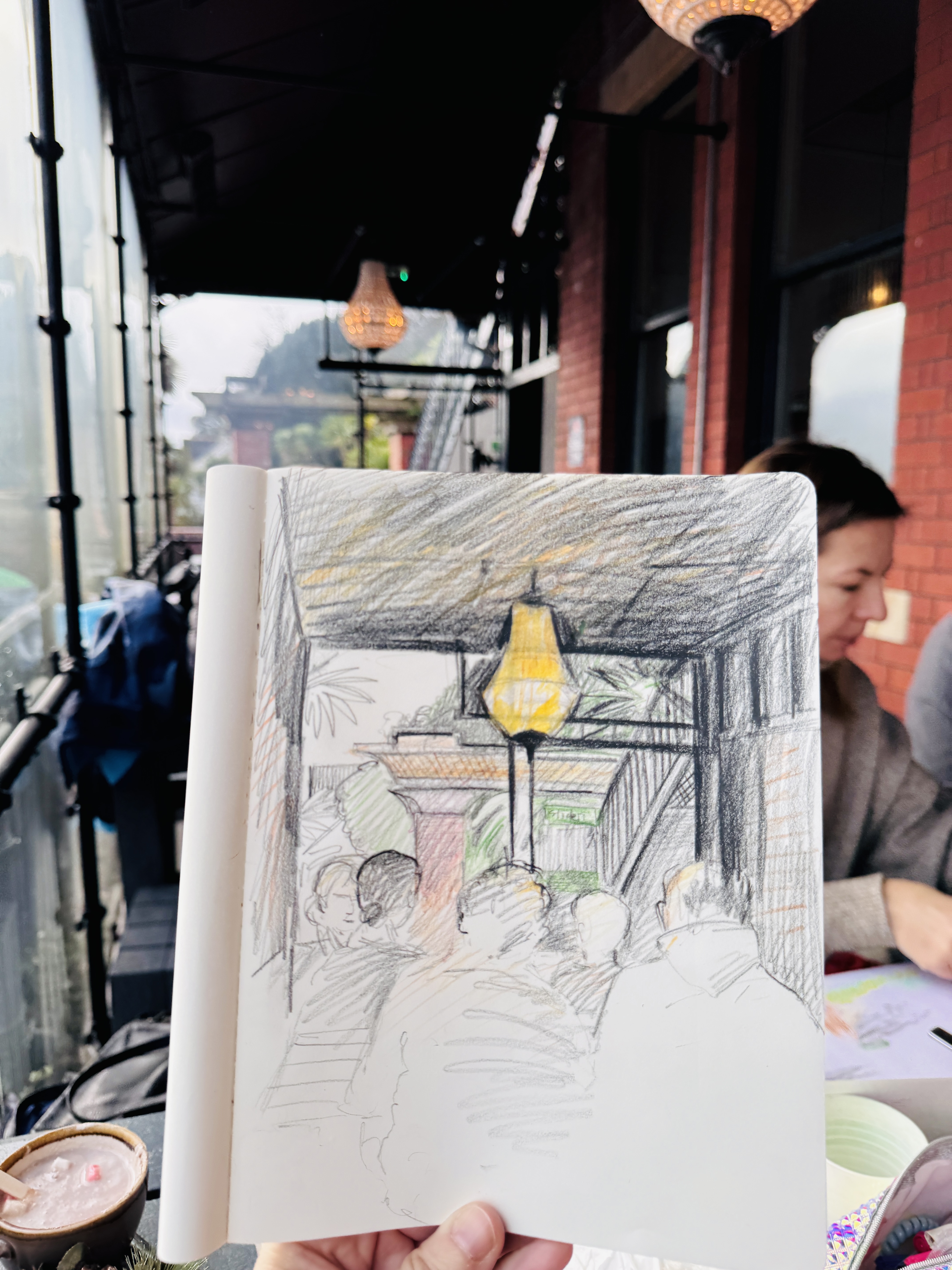 Sketchbook drawing made at a café table in Penarth