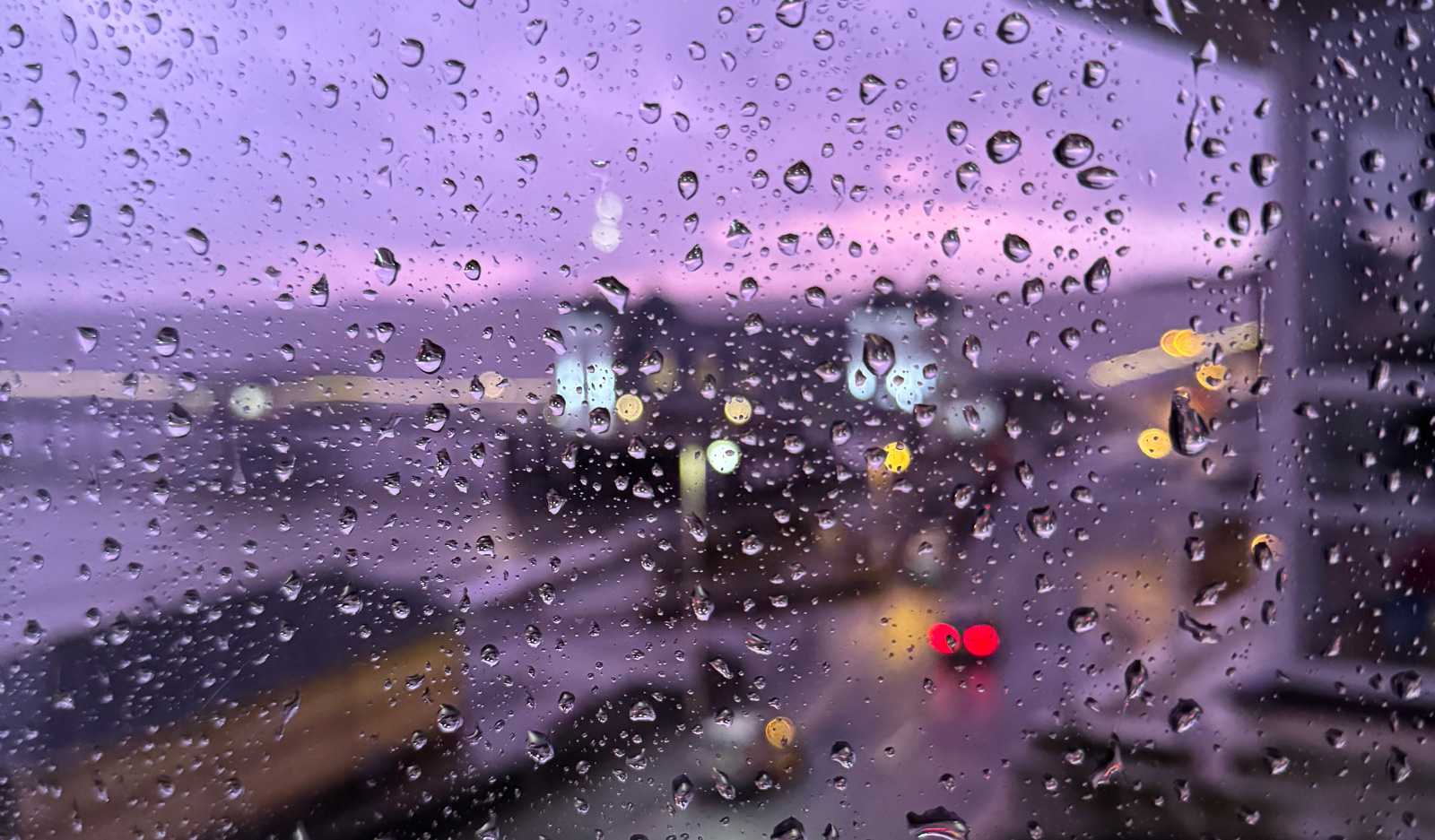 Rain on a Penarth window in December, the pier blurred behind