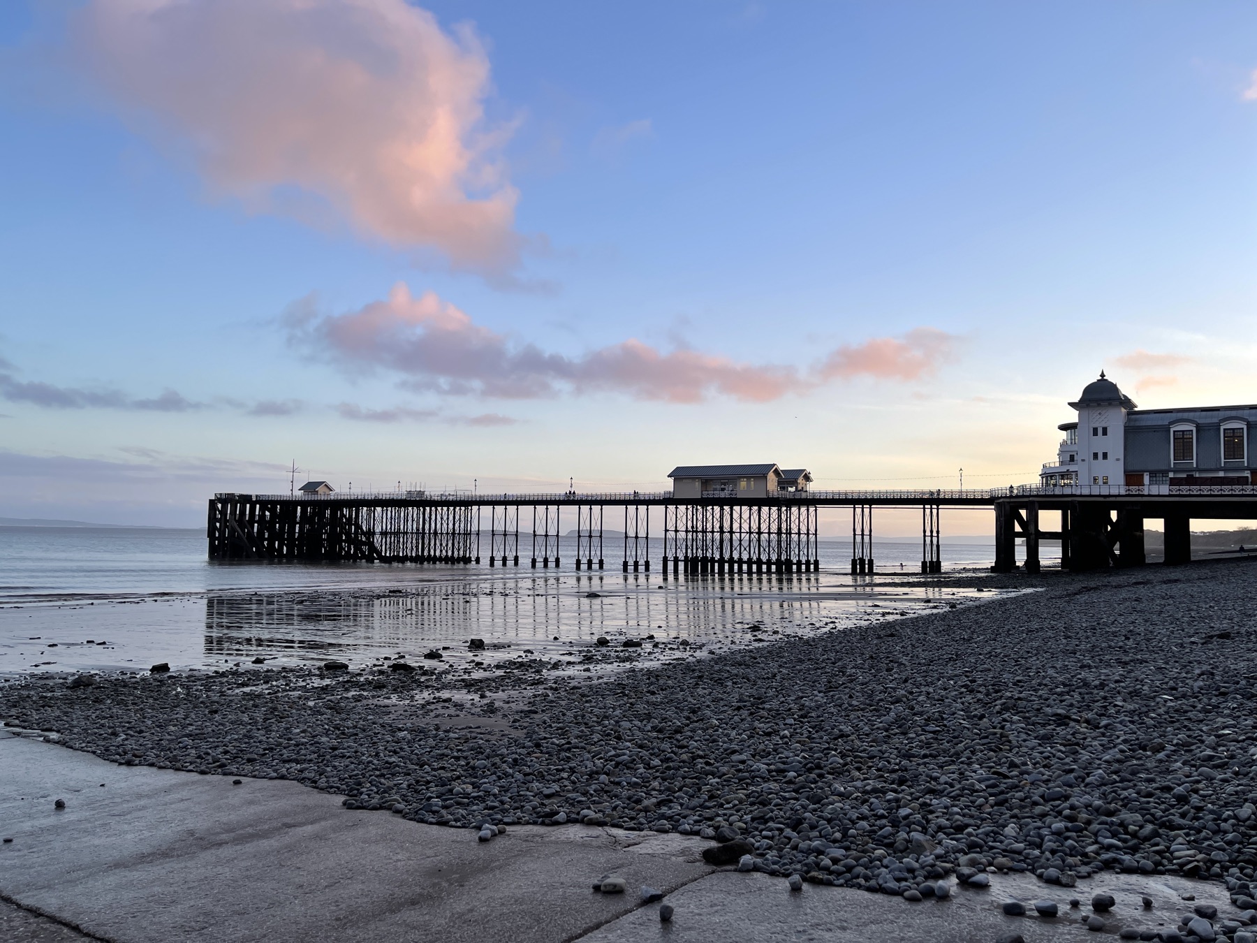 Penarth Pier in evening light at low tide