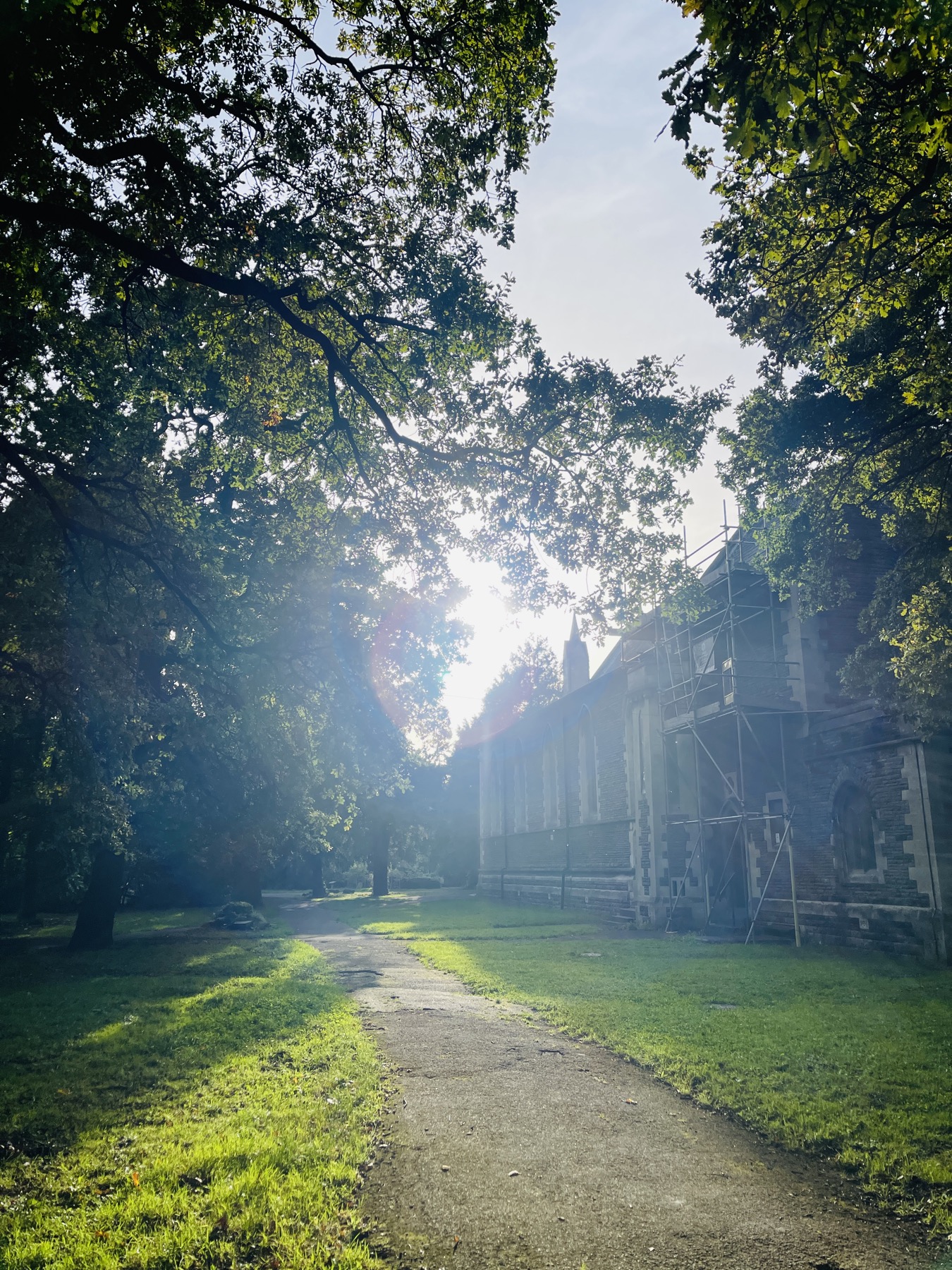 All Saints Church and path in low evening light